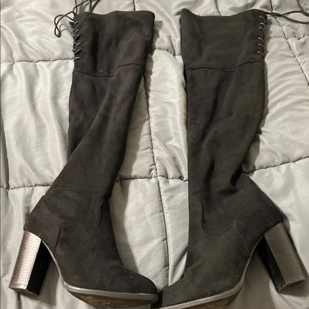 Black knee high boots.